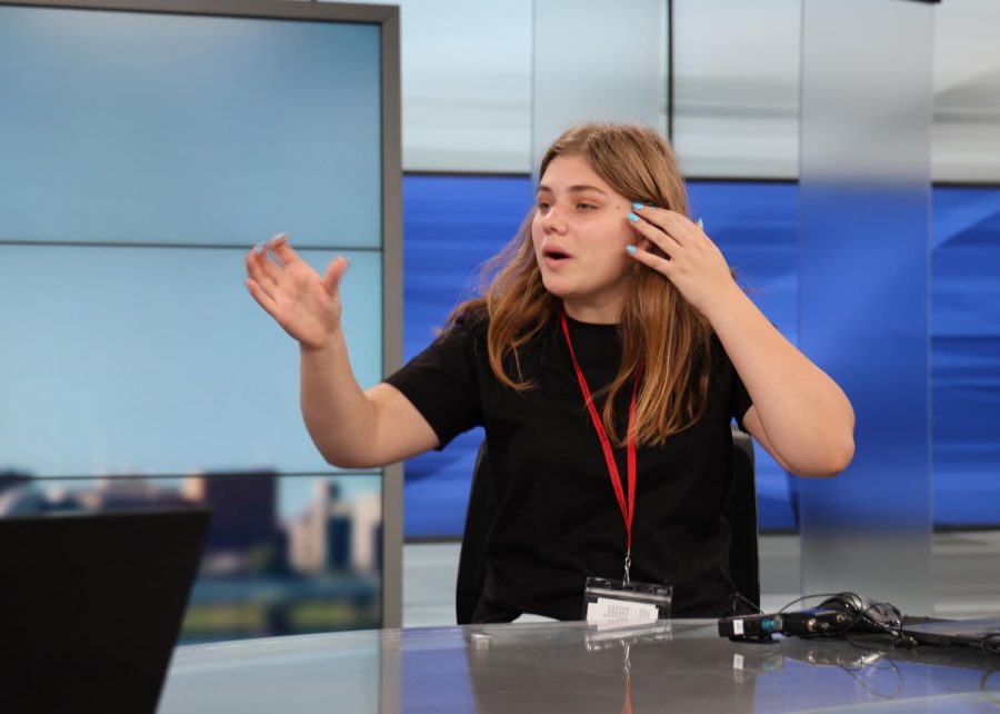 Xposure student Delilah Brumer sits on set during a tour of WDRB news in Louisville on June 15. 