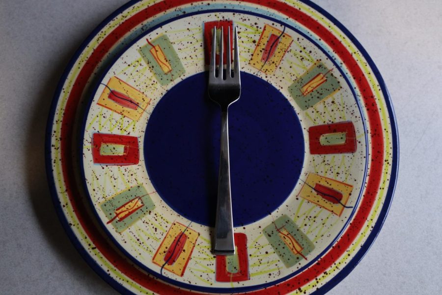 An empty plate sits on a table, symbolizing eating disorders.