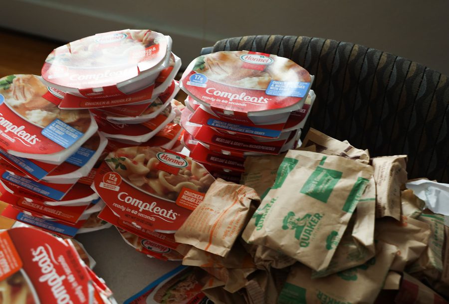A stack of various dinners are stacked in the WKU Office of sustainability.